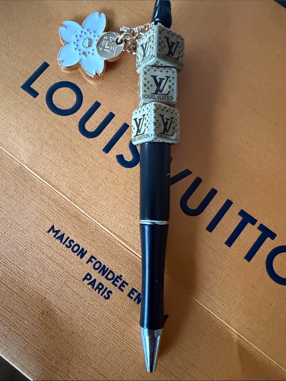 Handmade beaded pen with flower and golden charm